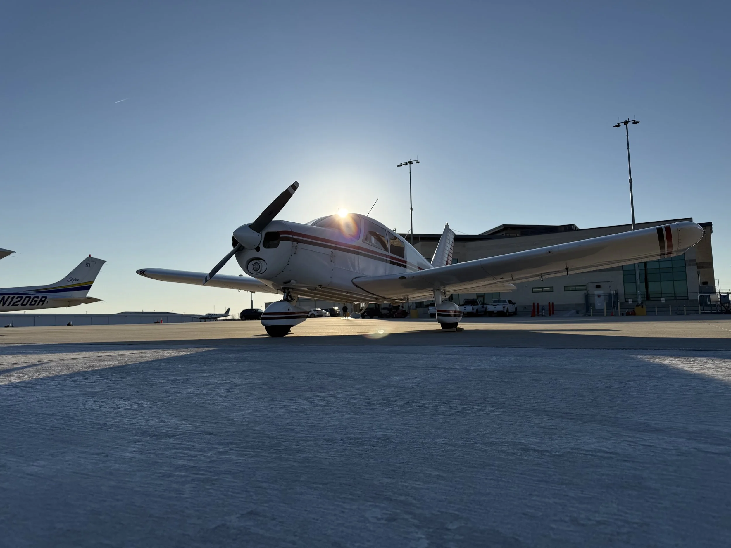 Flight instructor and student preflighting a Cessna 172